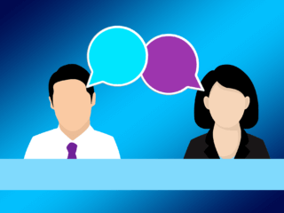 Illustration of a man and woman in business attire with speech bubbles